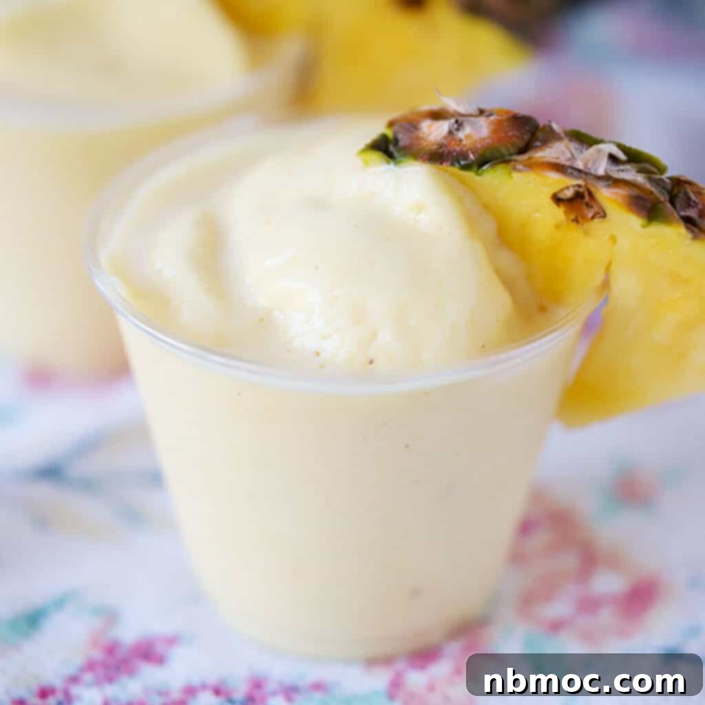 A plastic cup with disney dole whip.