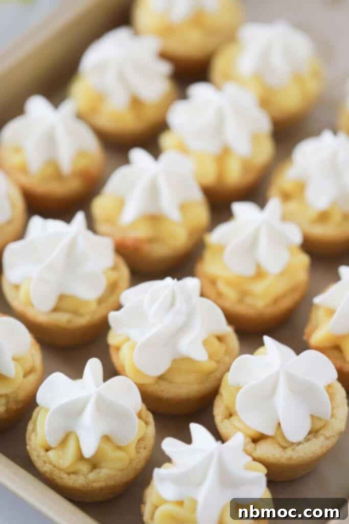 Banana Dream Cookie Cups 2 A baking sheet with banana pudding cookies lined up, ready to be served at a party.