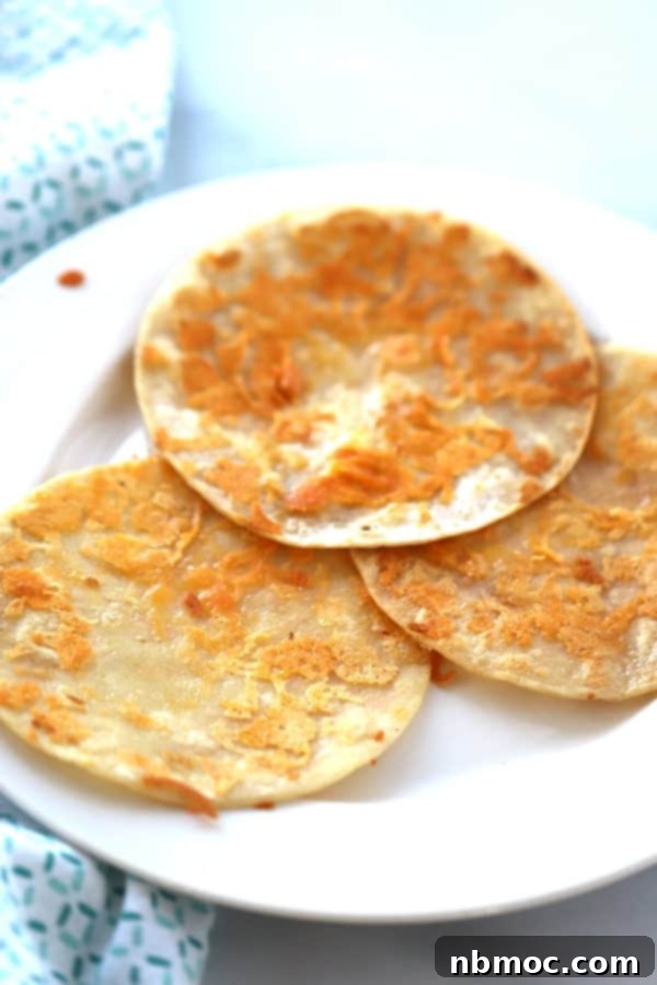 Cheese Fried Tortilla Corn Shells on a white plate used for cilantro lime crock pot chicken, 