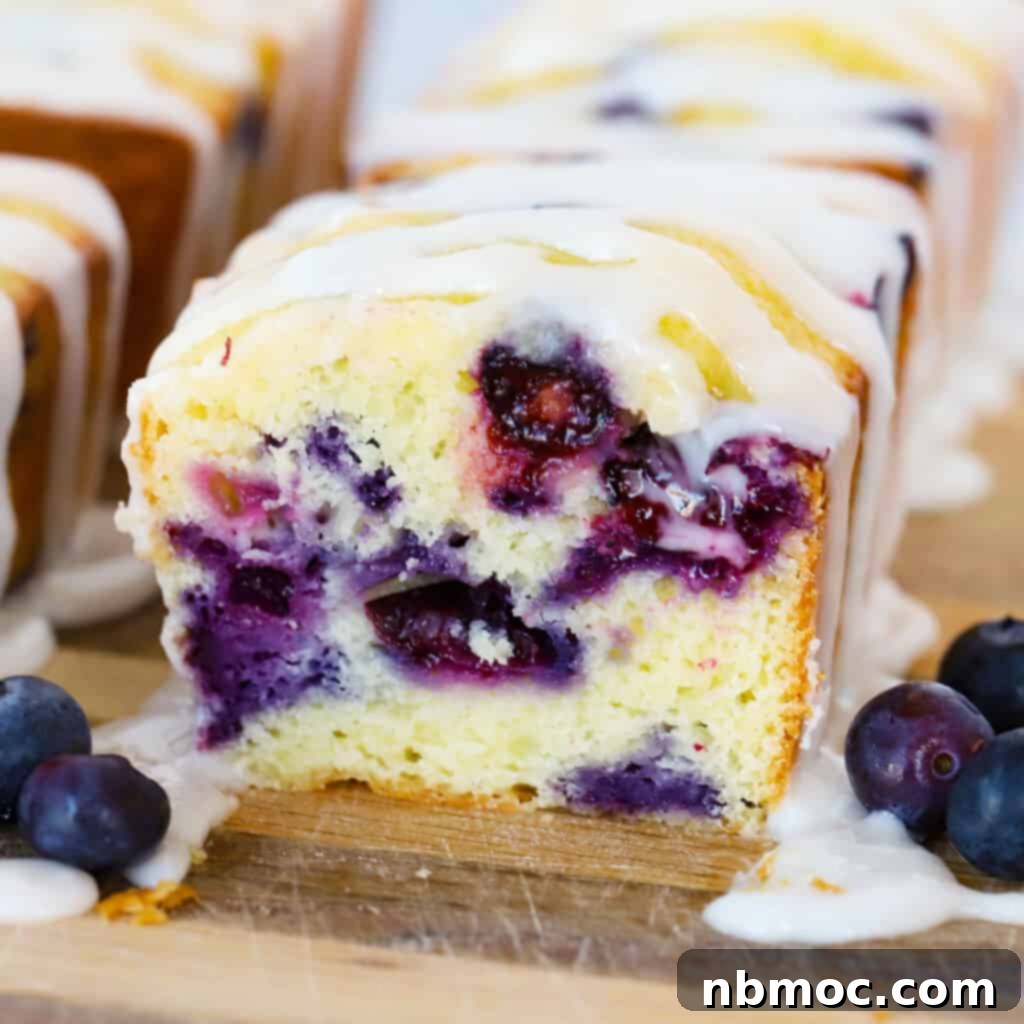 Zesty Lemon Treats 19 blueberry mini loaves on a wood cutting board, lemon blueberry bread.