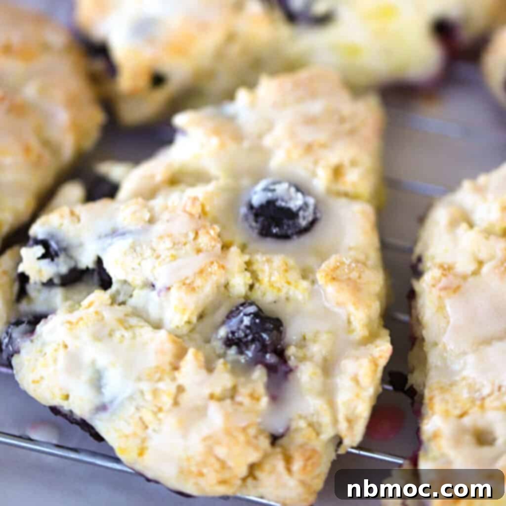 Zesty Lemon Treats 23 Lemon Blueberry scone with lemon glaze, easy breakfast recipe.