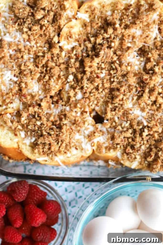 A full baking dish of coconut french toast topped with pecan crumble.