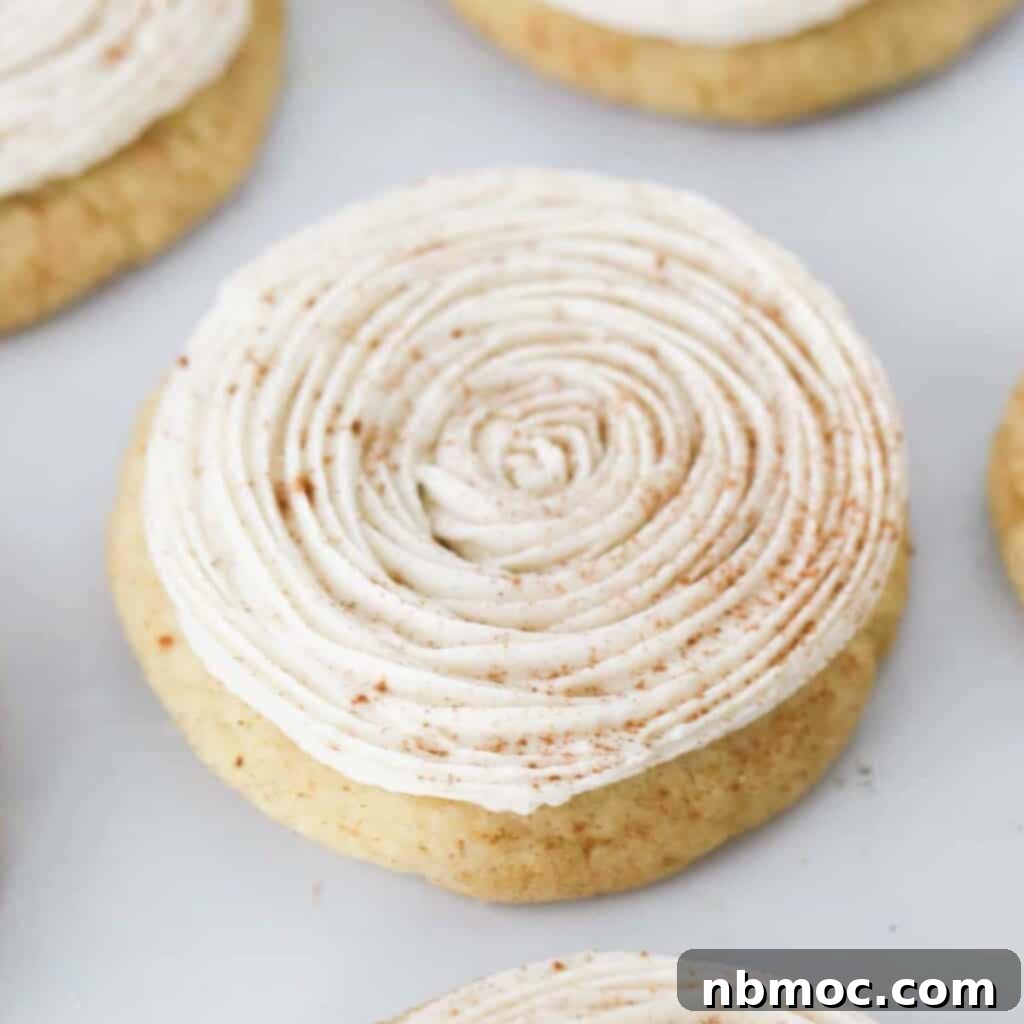 Irresistible Pumpkin Delights 12 Pumpkin Spice Snickerdoodles topped with frosting and cinnamon.