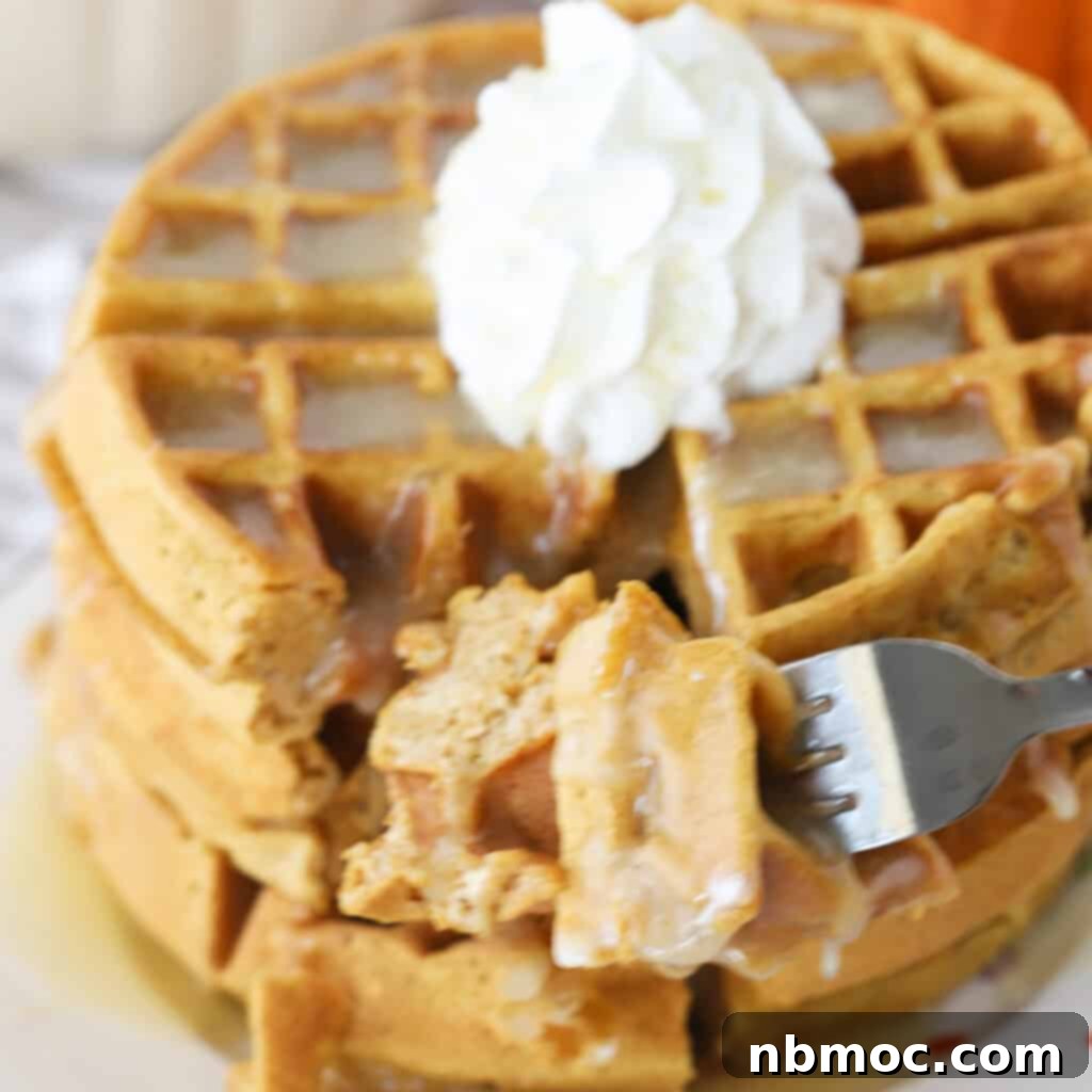 Irresistible Pumpkin Delights 17 homemade pumpkin waffles being eaten with a fork.