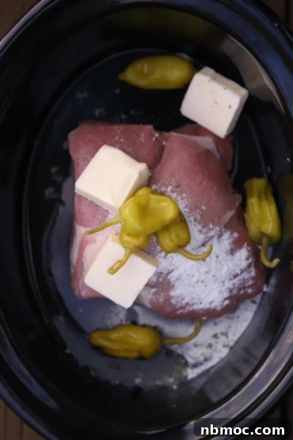 mississippi roast pork ingredients in a crockpot. 