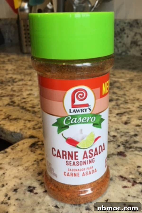 Zesty Chili Lime Sheet Pan Chicken and Veggies 4 Lawrys carne asada seasoning on a tabletop.