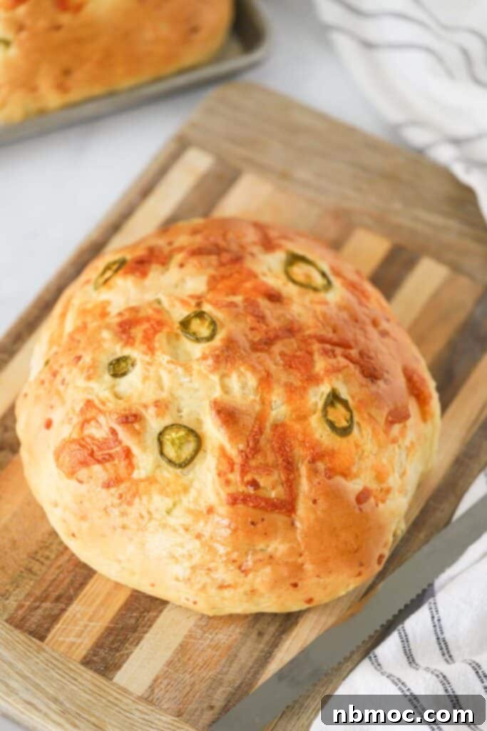 Recipe for jalapeno cheddar bread, an easy jalapeno bread recipe on a cutting board.