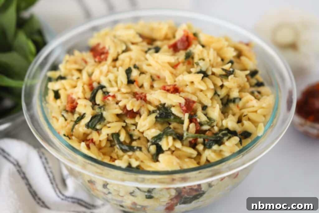 Creamy Tuscan Orzo 3 Tuscan orzo in a glass bowl.