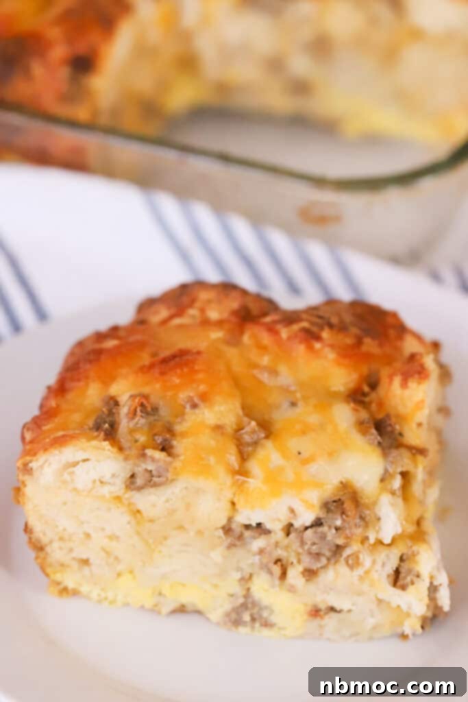 Effortless Sausage Egg Biscuit Brunch Bake 2 A slice of sausage biscuit breakfast casserole on a plate, ready to be enjoyed.