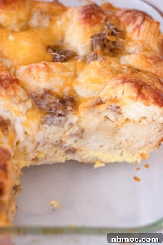 Effortless Sausage Egg Biscuit Brunch Bake 5 A perfectly baked slice of sausage biscuit casserole, showcasing an easy make-ahead breakfast option.