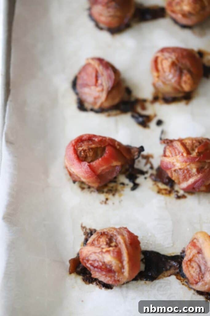 Bake bacon-wrapped meatballs on a baking sheet until the bacon is crispy.