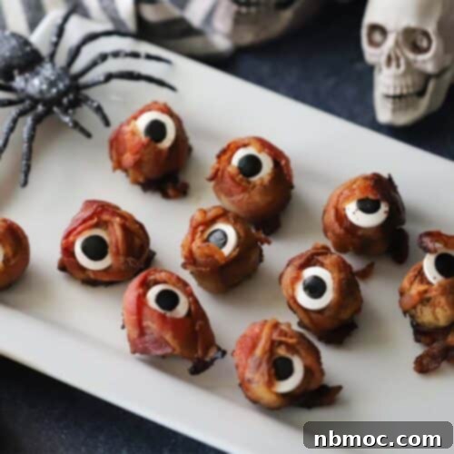 A serving plate with Halloween cyclops meatballs, ready for a party.