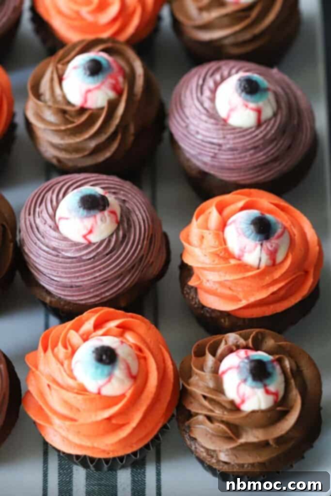 Halloween Eyeball Cupcakes with colorful frosting and candy eyeballs.