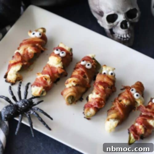 A delicious and spooky Mummy Jalapeno Popper, ready to eat.