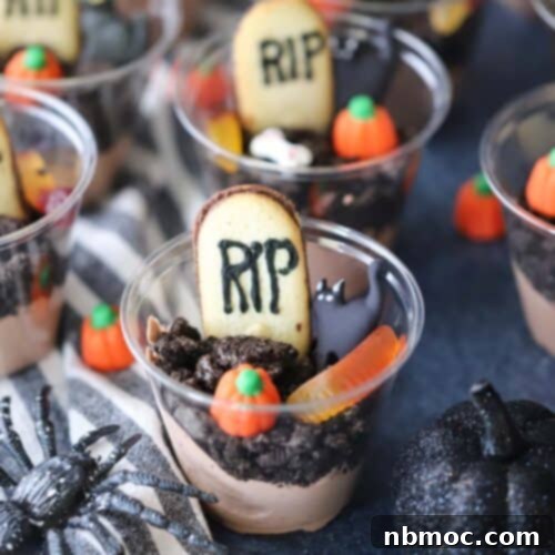 Haunted Earth Pudding Cups 6 graveyard dirt cups decorated for a halloween party, showcasing a close-up of the spooky details