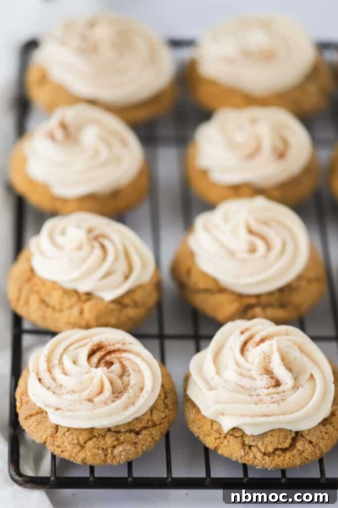 Dreamy Pumpkin Cream Cheese Cookies 2 A tray full of soft pumpkin cookies topped with creamy cream cheese frosting, a perfect fall dessert.