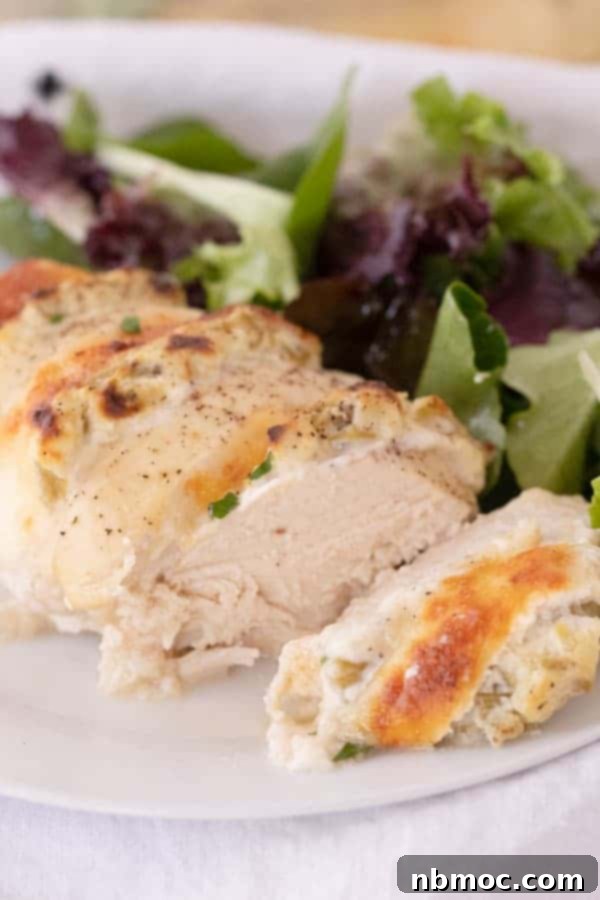 Accordion Style Green Chile Chicken 5 A serving plate with slices of this green chili chicken recipe and a side salad.