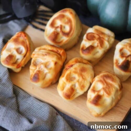 halloween pizza skulls on a serving plate.