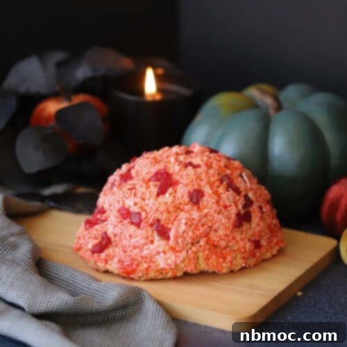 A halloween decorated table with a rice krispies brain.