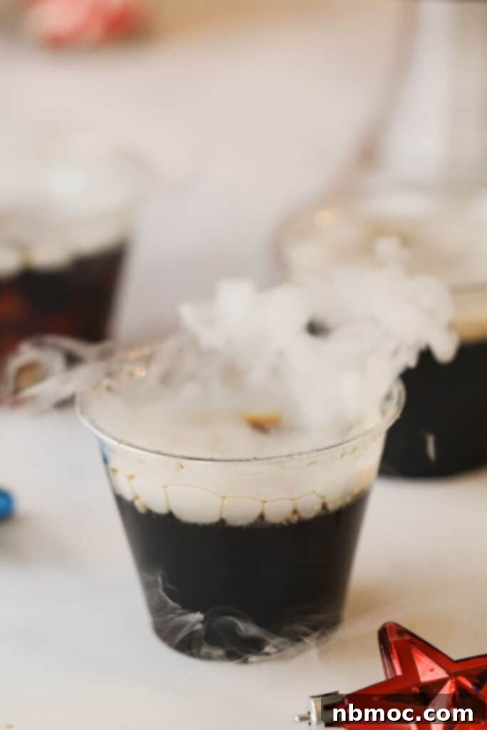 Crafting Your Own Root Beer 3 A close-up shot of a glass filled with freshly made homemade root beer, with a wispy mist rising from the surface, indicating the presence of dry ice. The drink looks refreshing and inviting.