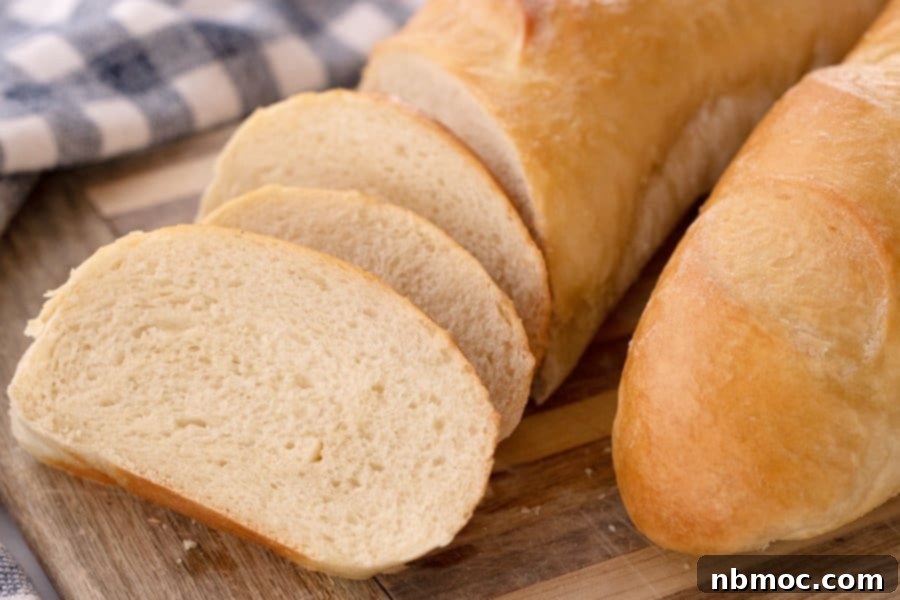 Classic French Bread sliced on a cutting board.