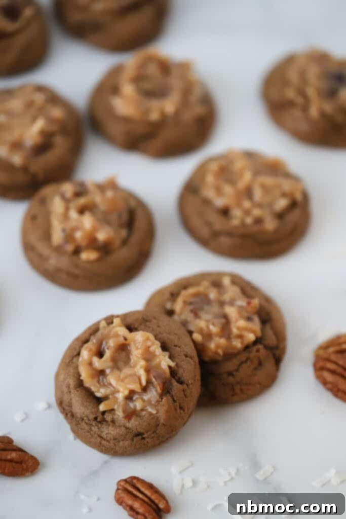 soft and chewy German chocolate cookies recipe topped with german chocolate frosting, the frosting is made with caramel, coconut, and pecans.