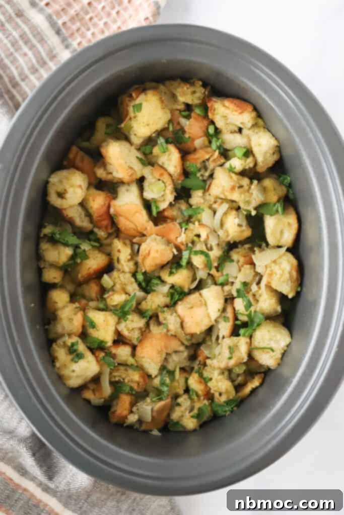 Set-It-and-Forget-It Stuffing 4 A slow cooker full of dry bread cubes and cooked onions and celery to make crockpot stuffing.