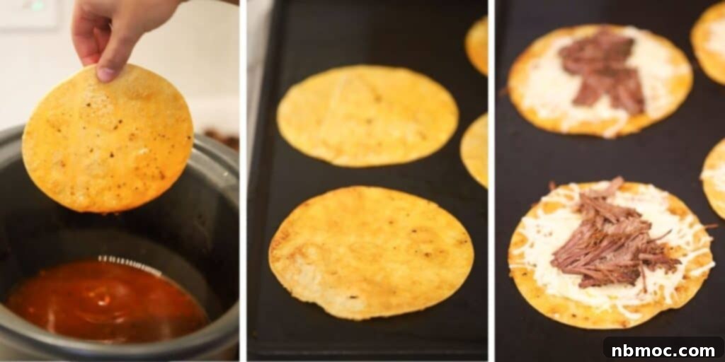 Corn tortillas on a skillet filled with birria beef and melted cheese.