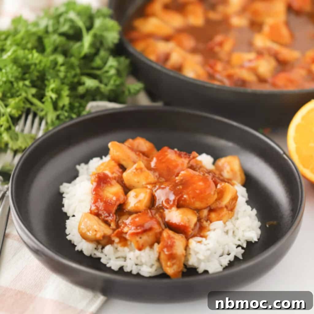 Homemade Orange Chicken on a wooden board