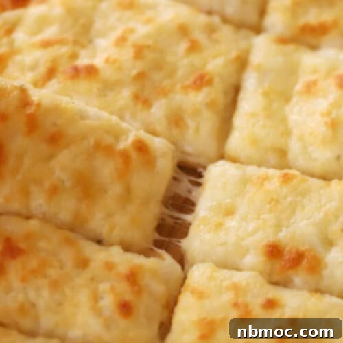 Delicious Homemade Cheesy Breadsticks, golden and perfectly baked.