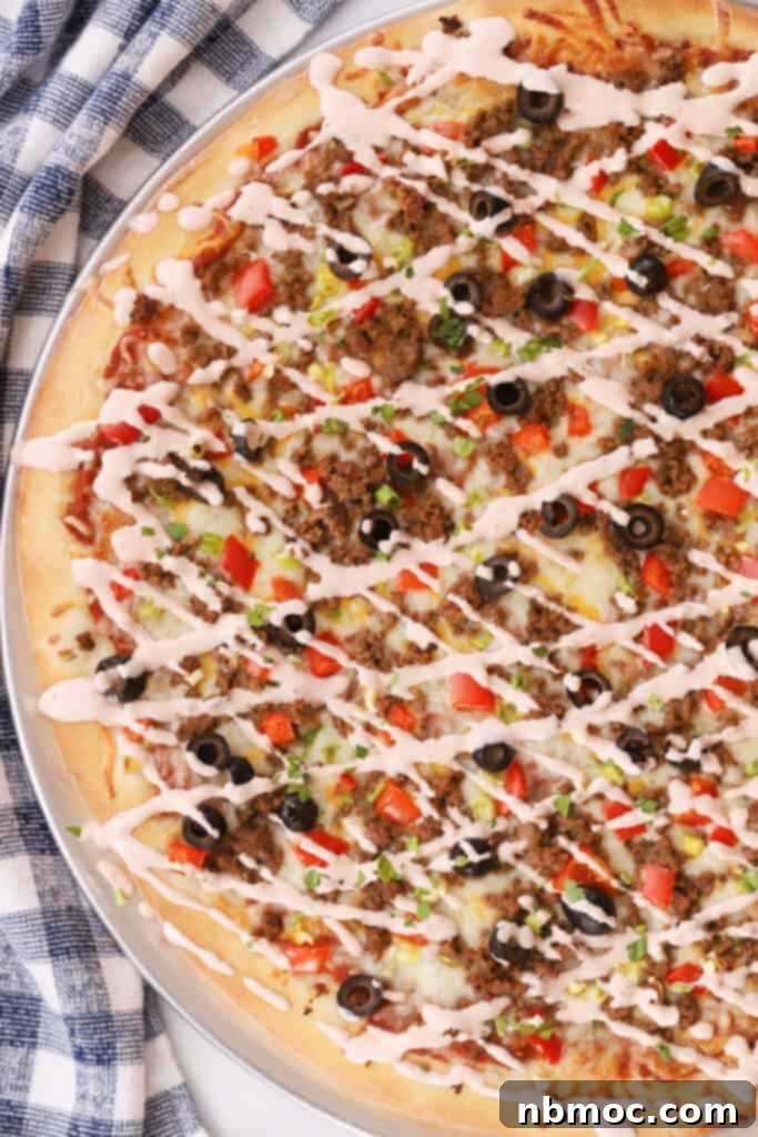Fiesta Taco Pizza 5 easy taco pizza, baked with a salsa ranch drizzle.