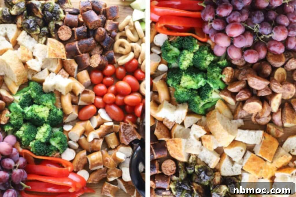 An assortment of cheese fondue dippers including bread chunks, pretzels, fresh fruit, veggies, and crackers.