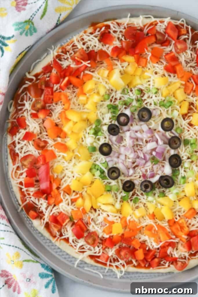 Garden Harvest Pizza 2 How to make veggie pizza with our recipe for pizza dough and pizza toppings that are in a colorful rainbow pattern.