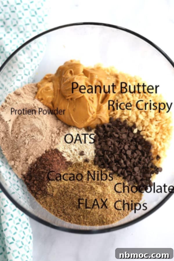 Power-Packed Triple Chocolate Oat Bites 4 The ingredients to make chocolate peanut butter energy balls in a glass bowl.