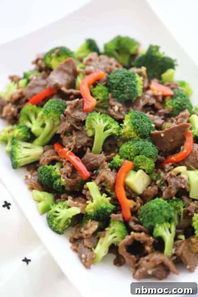 Sticky Teriyaki Beef and Vegetable Skillet 2 Easy teriyaki beef stir fry on a white plate served with rice.