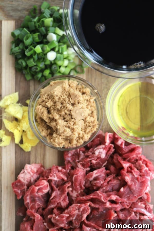 Sticky Teriyaki Beef and Vegetable Skillet 3 Ingredients for Beef teriyaki marinade with Broccoli stir fry on a wood cutting board.