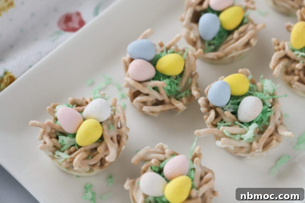 Chow mein noodle haystacks turned into easter dessert by using coconut grass and mini candy eggs.