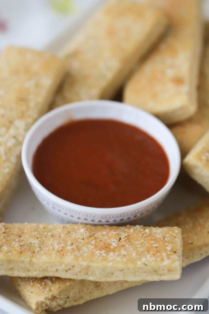 Golden Grain Breadsticks 2 Whole wheat breadsticks with a side of marinara sauce.
