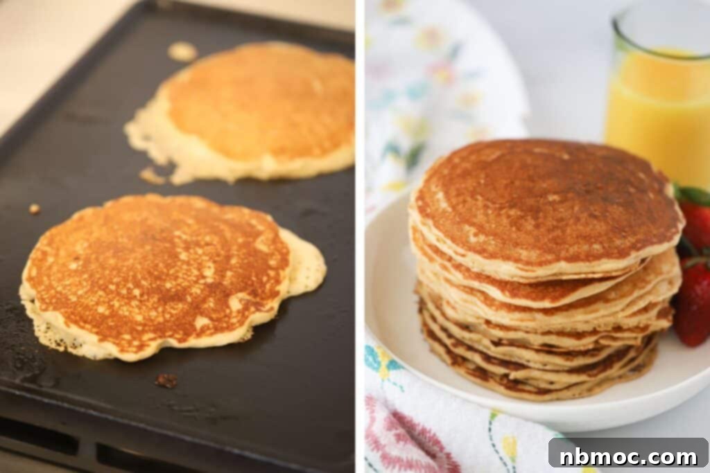 Freshly cooked whole wheat pancakes neatly stacked on a white plate, served alongside a glass of refreshing orange juice.