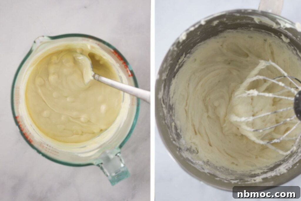Melted white chocolate in a glass measuring cup with a stand mixer bowl full of cream cheese frosting.