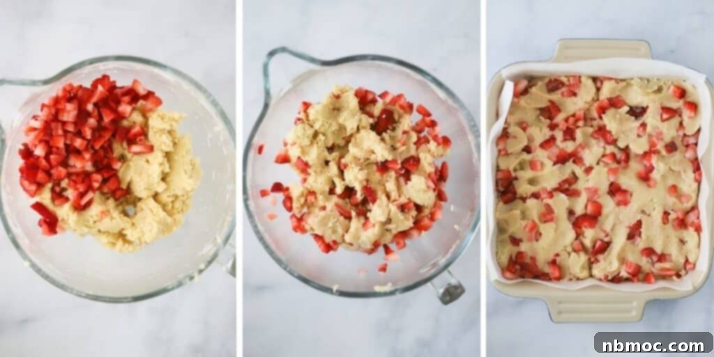 Making the batter for this strawberry blondie recipe and then adding it to a baking dish.