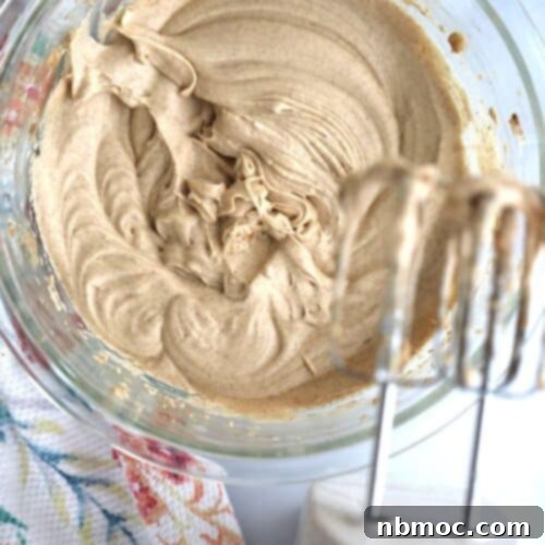 Homemade whipped cinnamon honey butter with an electric hand mixer