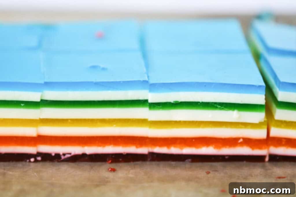 Jello Rainbow Stack 4 Cut squares of rainbow layered jello.