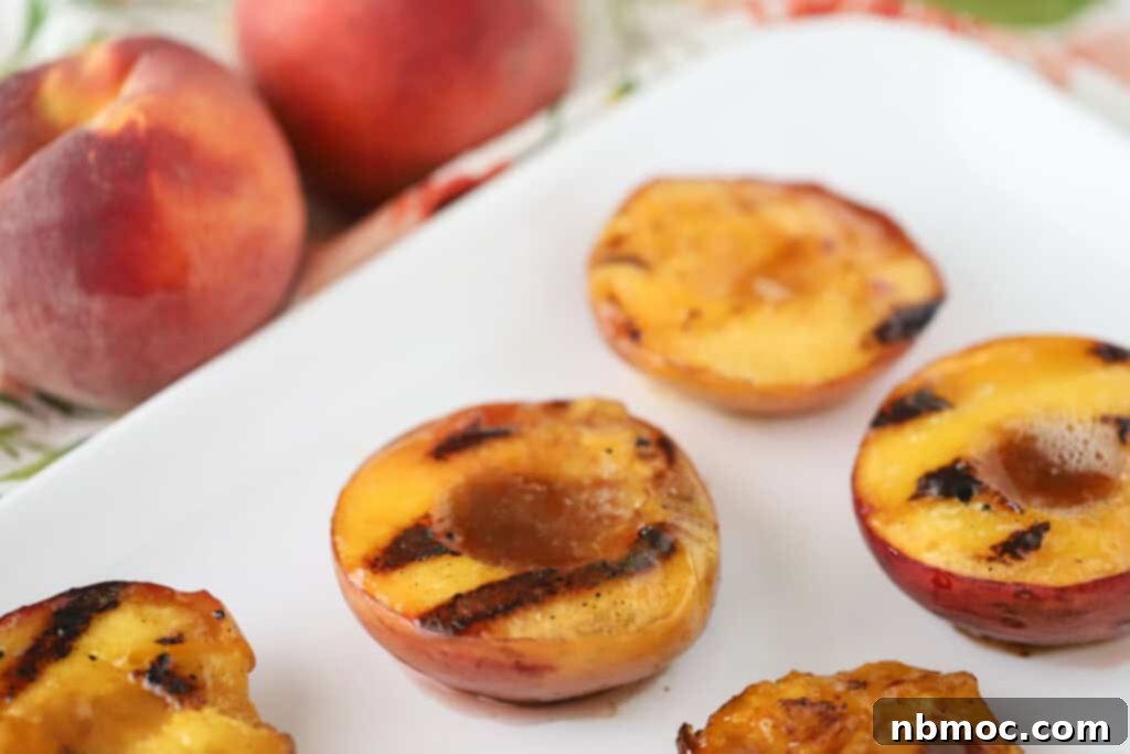 Fire Kissed Peaches 4 A platter with peaches from this grilled peaches recipe, topped with buttery brown sugar and cinnamon.