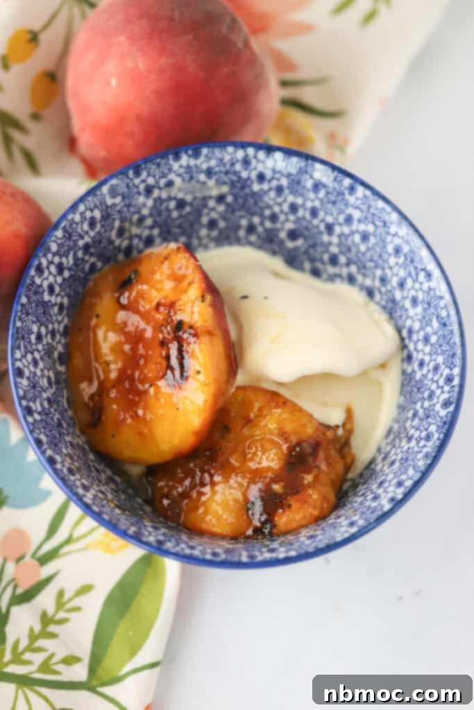 Fire Kissed Peaches 5 A bowl with grilled peaches and vanilla ice cream.