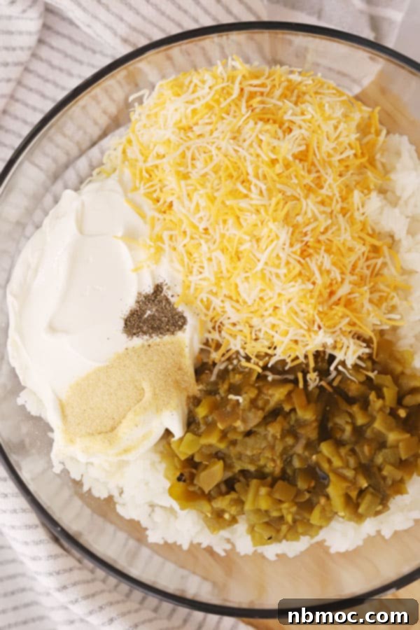 Creamy Green Chile Rice Bake 3 Ingredients for green chili rice casserole in a glass bowl ready to mix together.