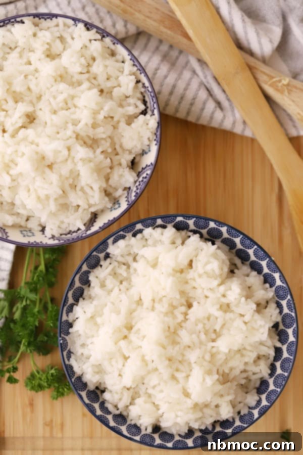 Close-up of fluffy coconut jasmine rice in a bowl, showcasing its perfect texture.