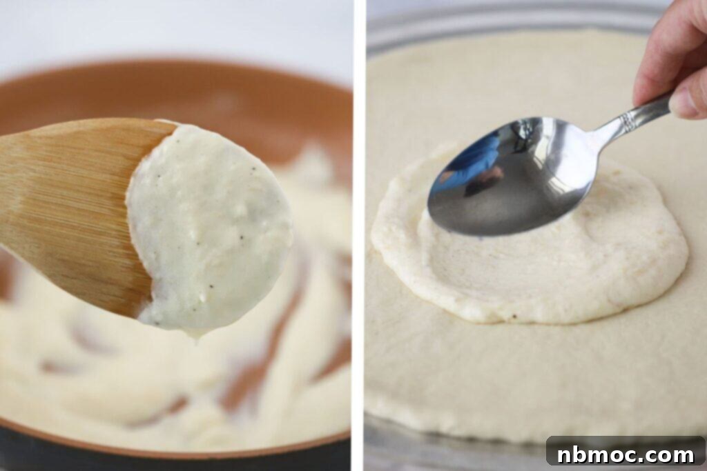 Spreading homemade white sauce on pizza.