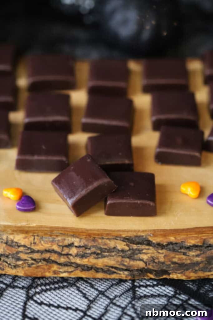 Midnight Licorice Caramels 2 A serving platter full of squares of black licorice caramels.