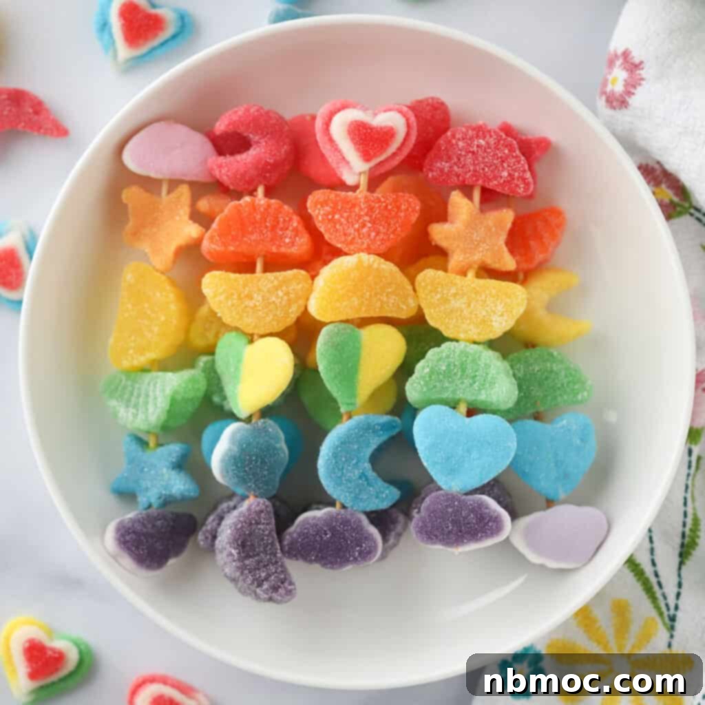 A festive plate brimming with vibrant candy kabobs, showcasing a delightful assortment of colorful sweets threaded onto skewers.